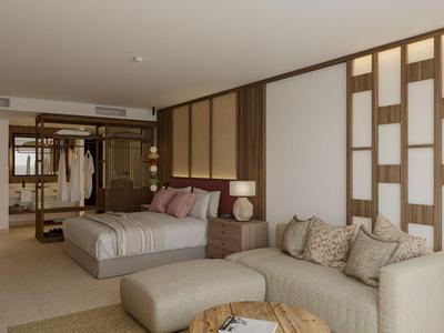 Elegantes Hotelzimmer mit Doppelbett, Sofa, Holzakzenten und warmem Licht.