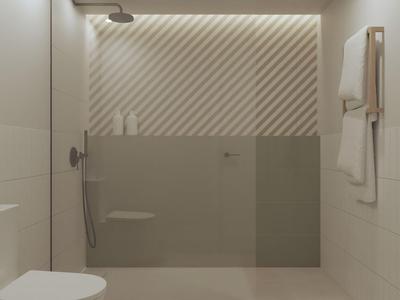 Modernes Badezimmer mit beiger Dusche, Toilette und Handtüchern an der Wand.