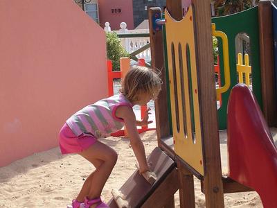 Colorful kids playroom with toys, soft mats, and seating, ideal for children at a hotel or resort.