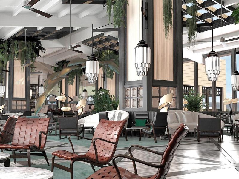 Spacious hotel lobby with modern seating, plants, and natural light.