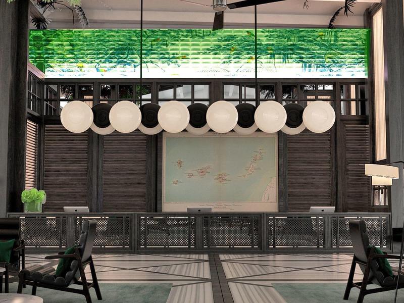 Hotel lobby with modern lighting, wooden chairs, and a large mural on the wall.