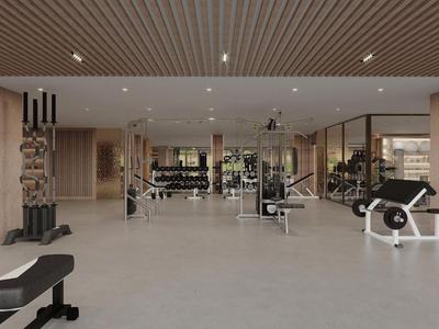 Palestra moderna con manubri, attrezzi e design luminoso in hotel