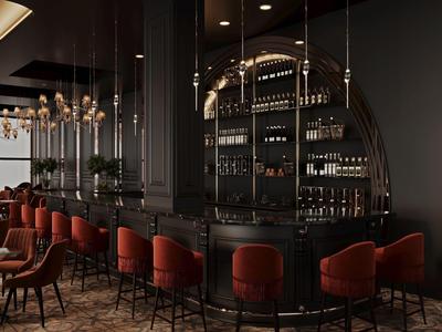 Bar dell'hotel elegante con mobili neri, sgabelli rossi e illuminazione elegante.