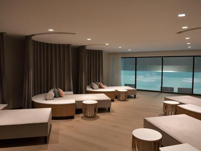 Modern, stylish lounge room with large windows and sea view.