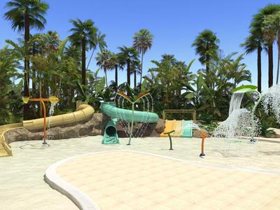 Vodní hřiště s tobogány a stříkajícími figurami v tropickém hotelu.