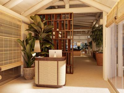 Moderner Empfangsbereich mit hellem Holz, Pflanzen und stilvollem Tresen in warmen Farbtönen.