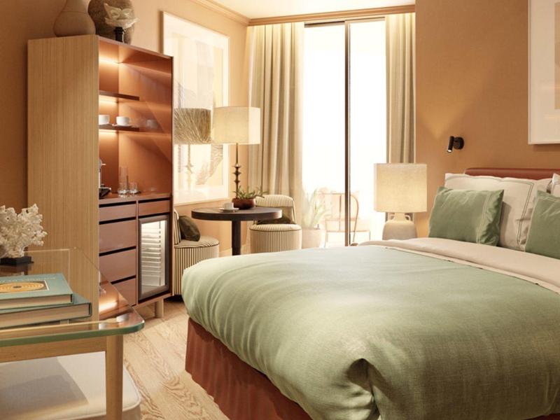 Gemütliches Schlafzimmer mit grünem Bett, Holzregal, kleinem Tisch und warmem Licht.