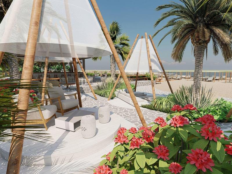 Strand mit weißen Sandsesseln unter hölzernen Sonnensegeln, Palmen und roten Blumen im Vordergrund.