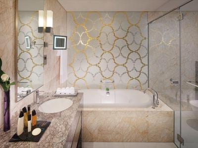 Baño elegante con lavabo de mármol, gran bañera y ducha de vidrio en diseño claro.