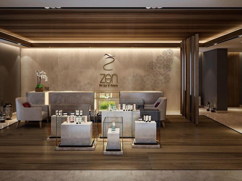 Modern luxury hotel lobby with stylish lighting and designer seating area.