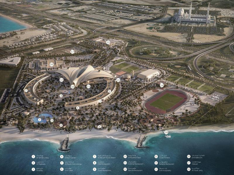 Luftaufnahme von Dubai mit Stränden, speziellen Wellenformen, Sportstadion und dichtem Straßennetz.