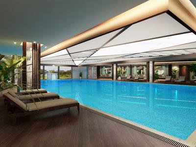 Piscina interna con lettini e illuminazione moderna, creando un'atmosfera rilassante.