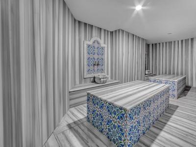 Modernes Hamam mit blau gemusterten Steinen und gestreiften Wänden in Grau- und Beigetönen.
