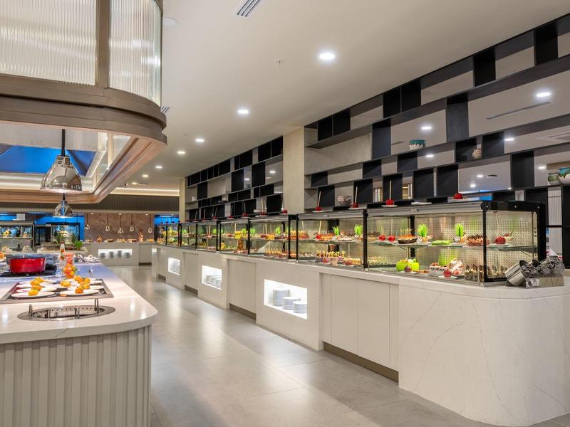 Bright buffet with a selection of dishes and modern decor in the hotel restaurant.