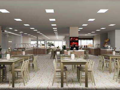 Großer, heller Speisesaal mit Holztischen und Stühlen, moderner Beleuchtung und Buffetbereich.