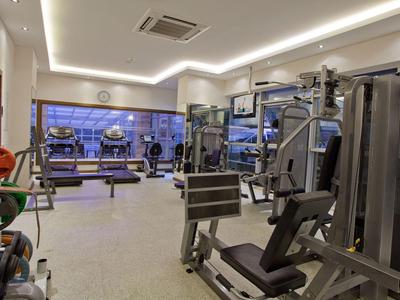 Interior of a well-equipped gym with modern exercise machines.