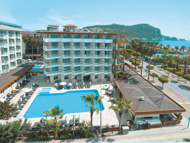 Hotel with large pool, multiple floors, and close to the sea in a sunny location