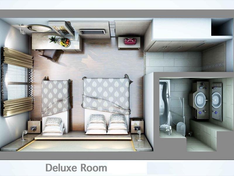 Top view of a deluxe room with two beds, a desk, and an attached bathroom.
