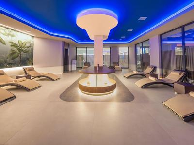 Modern spa with relaxing lounge chairs and stylish lighting.