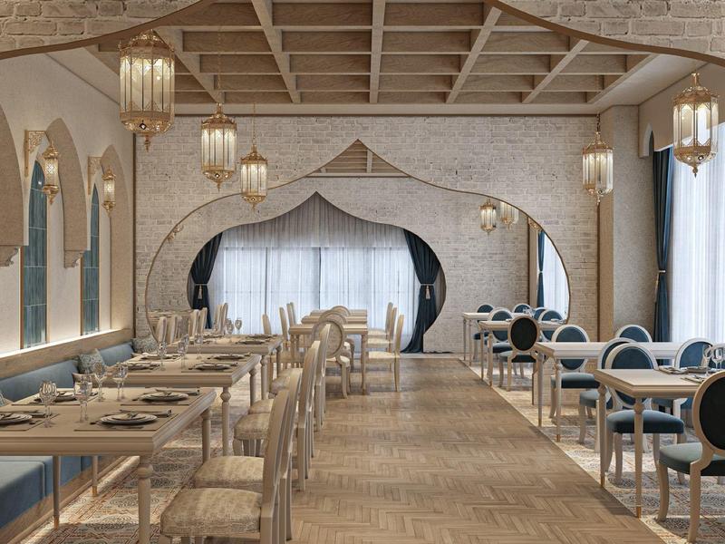 Comedor elegante con sillas cómodas, grandes ventanas y lámparas decorativas en la pared.