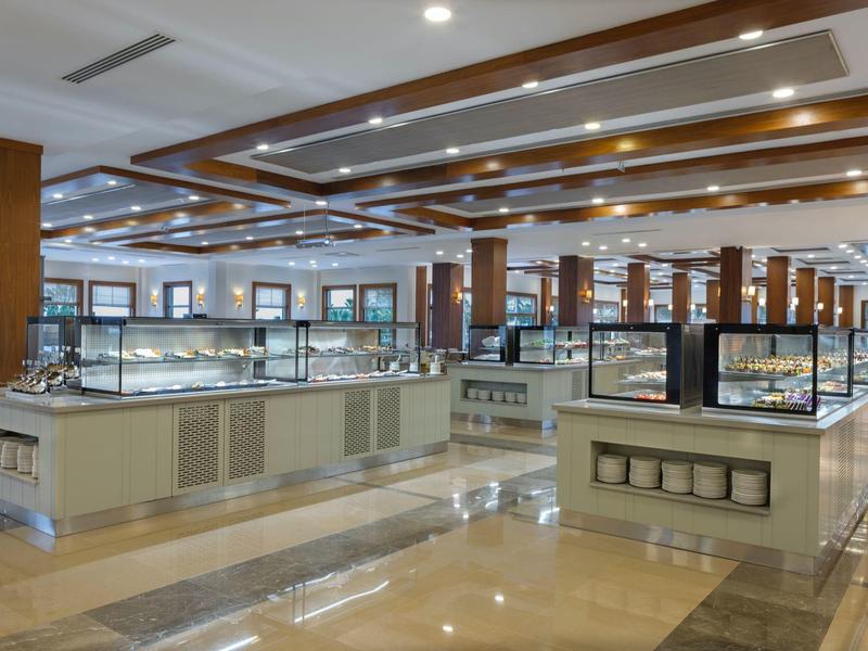 Large, bright interior with multiple display counters and shiny flooring.