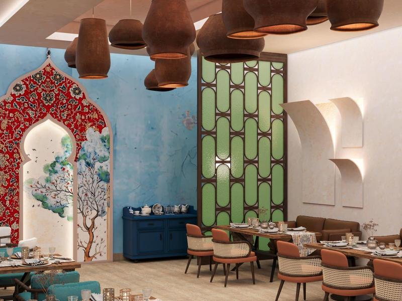 Restaurant élégant au décor coloré d'inspiration orientale avec des sièges confortables.