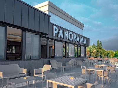 Terrasse sur le toit moderne avec sièges et vue panoramique par ciel clair.