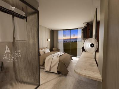 Habitación de hotel moderna con cama doble, ventana grande e interior elegante al atardecer.