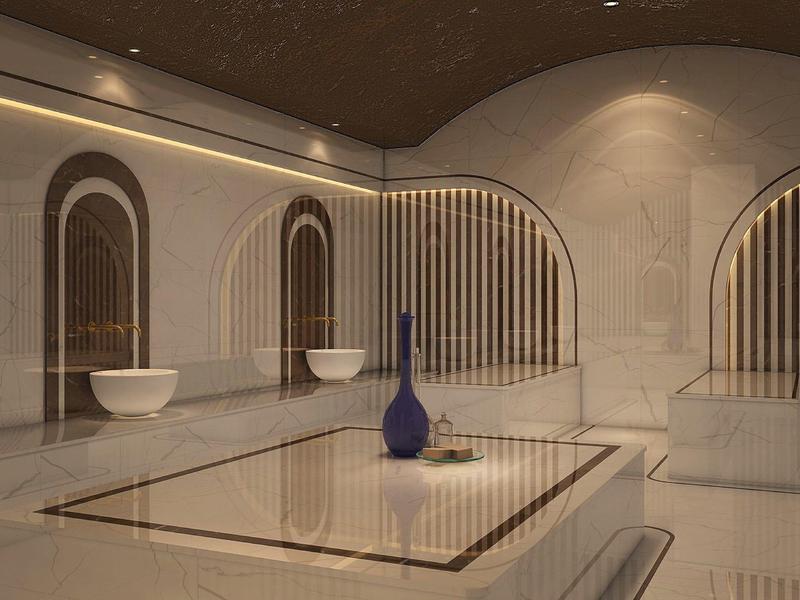 Elegantní wellness s hammamem, vyhřívanými kamennými lehátky a naplněnými lahvičkami parfémů.