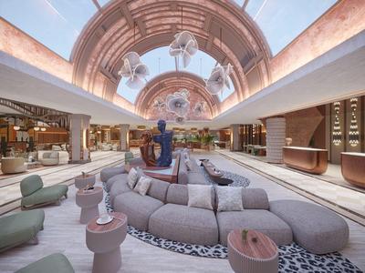 Moderna recepción de hotel con amplias áreas de asiento, fuente y diseño artístico en el techo.