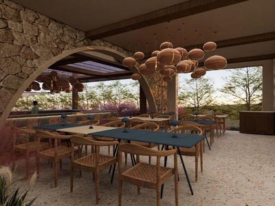 Área de comedor abierta con sillas de madera, mesas azules y iluminación orgánica en un hotel.
