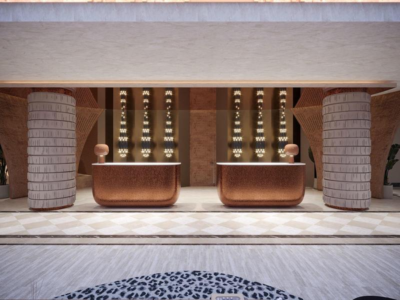 Hall d'hôtel avec deux comptoirs de réception, piliers décoratifs et éclairage chaleureux.