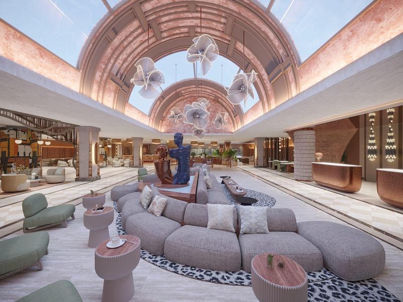 Grand espace intérieur avec canapés confortables, tapis et plafond en dôme dans un hôtel.