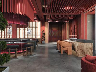 Moderne hotellounge met rood design, comfortabele zitplaatsen en groene planten.