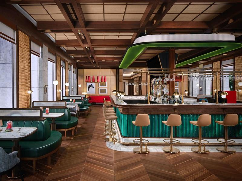 Modern eingerichtete Hotelbar mit grünen Sesseln und Holzfußboden in warmem Licht