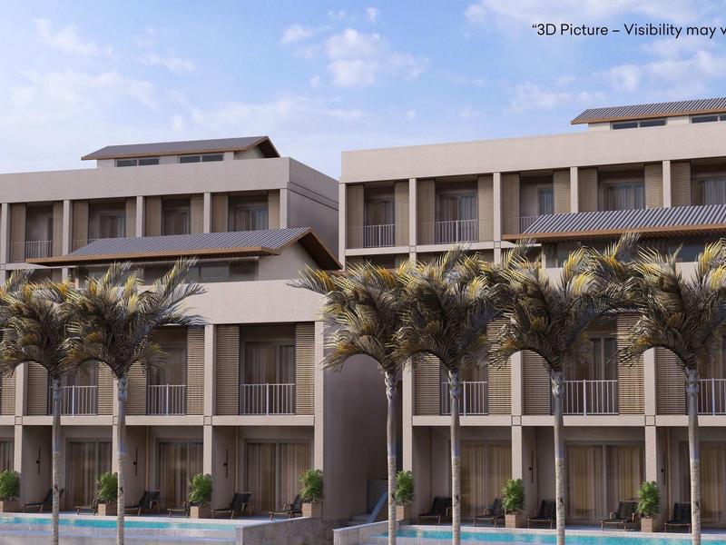 Bâtiment moderne avec de grandes fenêtres, des palmiers et un ciel clair en arrière-plan.