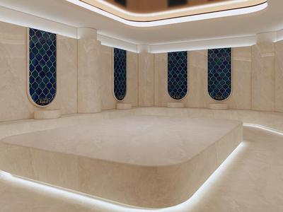 Luxe ronde spa-ontspanningsruimte met indirecte verlichting en blauwe raamdetails.