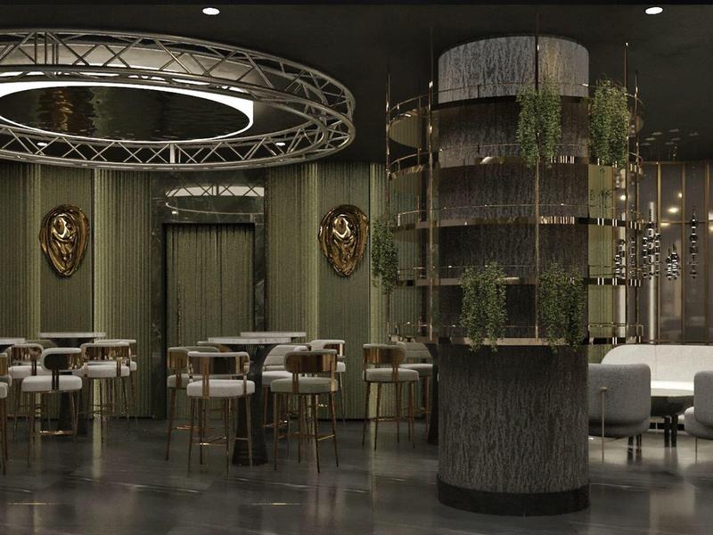 Elegant restaurant met moderne stoelen, tafels en een groene pilaar in gedimd licht