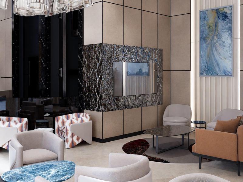 Elegante hotel lounge met moderne stoelen, wandkunst en marmeren details.