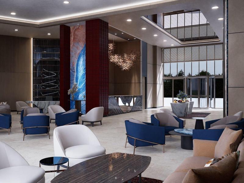 Moderne hotellobby met stijlvolle zithoeken, blauw-witte stoelen en decoratieve verlichting.