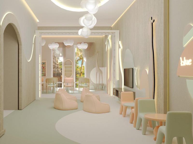 Lichte, moderne wachtruimte met zitzakken, neutrale kleuren en groot raam