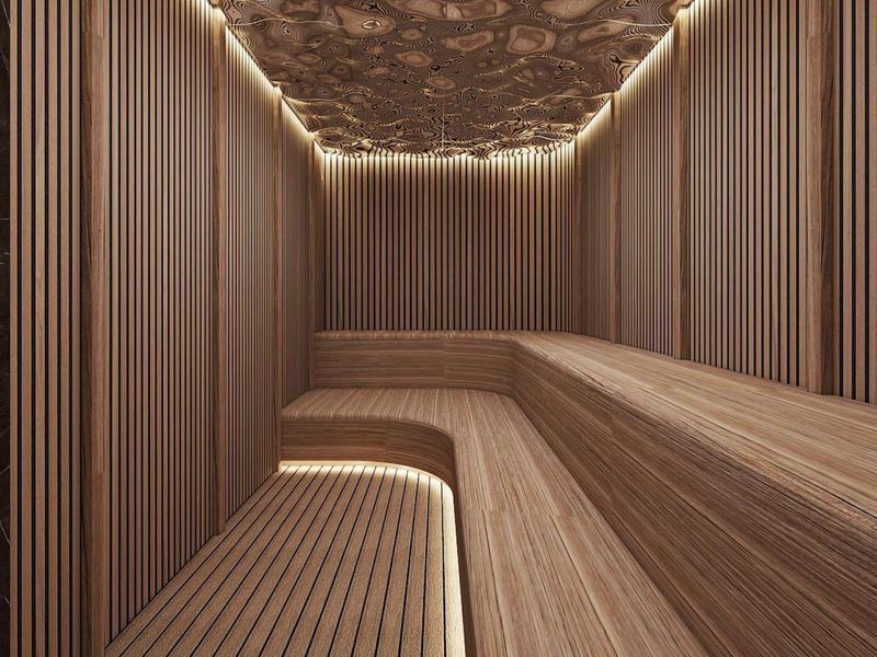 Moderne houten saunaruimte met indirecte verlichting en elegante plafondbekleding.