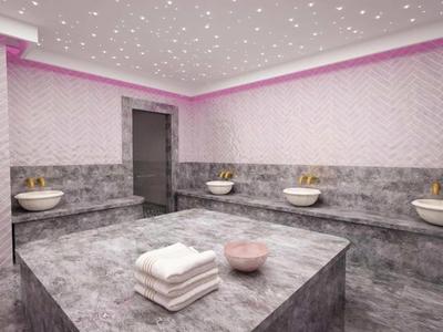 Moderner Hammam mit grauen Marmorflächen, Waschbecken und Sternenhimmel-Decke in warmem Licht.