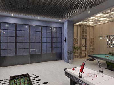 Area ricreativa moderna con calcio balilla, air hockey e tavolo da biliardo in stanza luminosa.