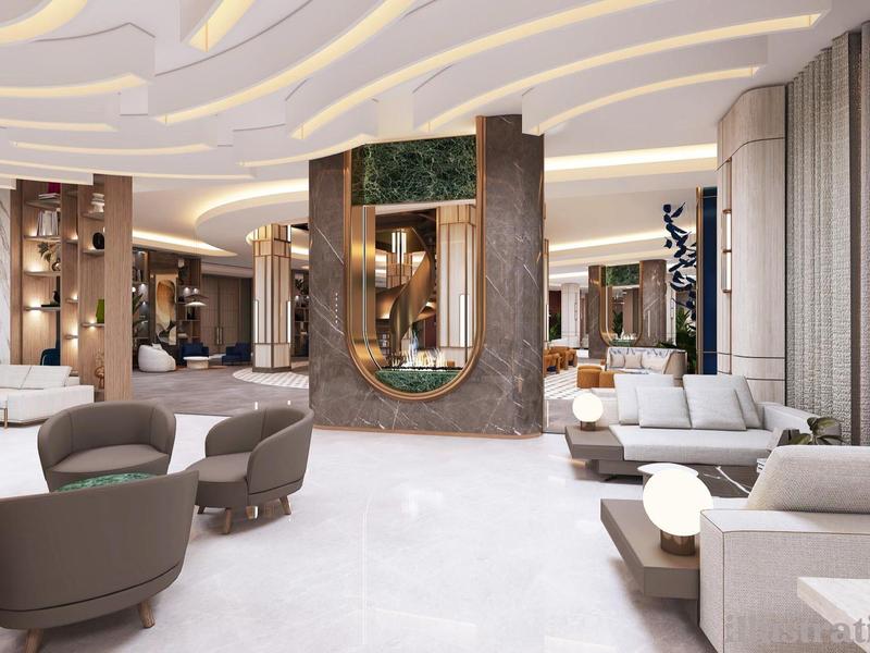 Vestíbulo de hotel moderno con asientos elegantes, piso de mármol claro y espejo decorativo.