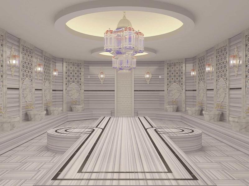 Bright, modern Turkish bath with marble, symmetrical basins, and chandelier.