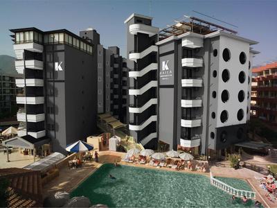 Modern hotel building with balconies and a pool surrounded by lounge chairs and umbrellas.