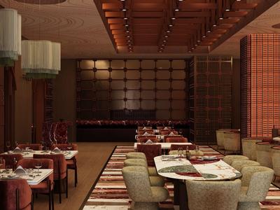 Elegant restaurant with dark wood, subdued lighting, and finely set tables.