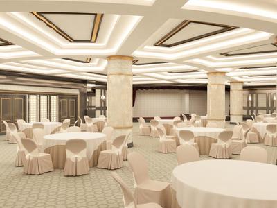 Großer Bankettsaal mit runden Tischen, beigen Stühlen und verzierten Säulen in hellem Farbton.