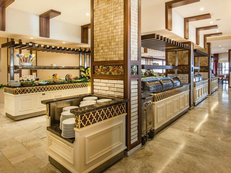 Elegant buffet area with wood and tile decor in a bright, spacious room.